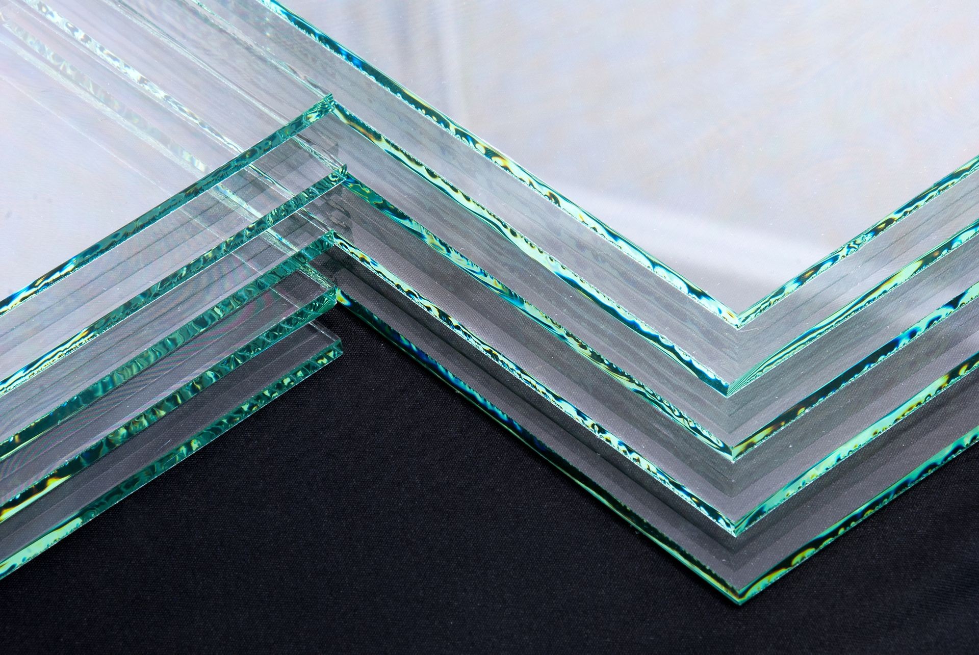 Sheets of Factory manufacturing tempered clear float glass panels cut to size.